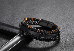 Detail of 6mm tiger eye stone beads and braided leather bracelet with magnetic black clasp