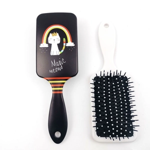 Detail of square air cushion hairbrush with cute rainbow cat print and Magic Meow text