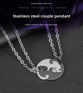 Detailed view of Yin Yang cat couple necklaces with polished stainless steel pendants