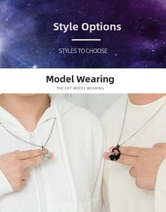 Detail of interlocking black and silver cat couple necklaces with minimalist chain design