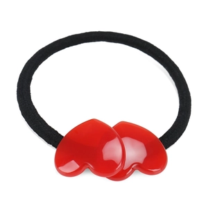 Detailed view of candy color acetate heart hair tie with black elastic band