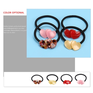 Minimalist heart-shaped acetate hair ties in colorful tortoiseshell and vibrant pastel tones