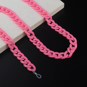 Close-up of pink acrylic chain link strap for glasses with metal ring and rubber loops