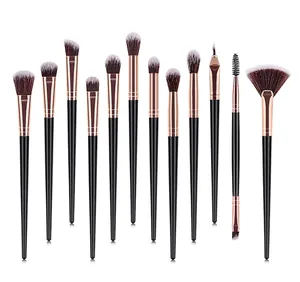 Detail of 12-piece professional makeup brush set with black handles and rose gold ferrules