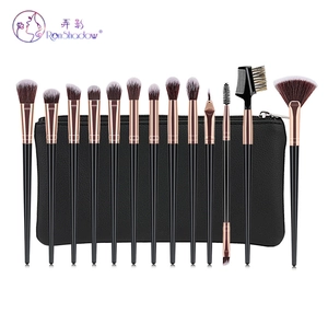 Detailed view of 13 professional makeup brushes with rose gold ferrules and travel pouch