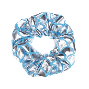 Close-up of shiny silver elastic scrunchie with blue fish scale pattern for kids