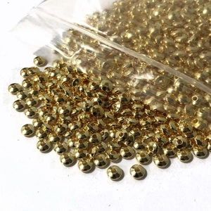 Detailed view of 14K gold filled spacer beads with shiny metallic finish for jewelry making