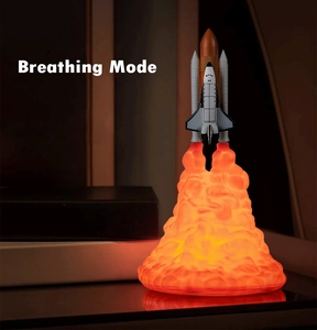 Detail of 3D printed rocket lamp with realistic orange fire base and breathing light mode