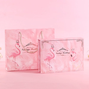 Pink European wedding gift bag and box with gold flamingo and feather designs