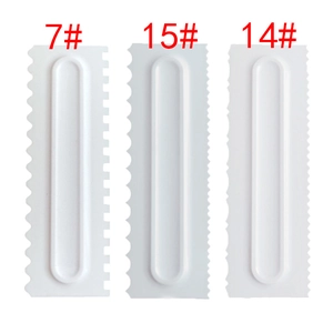 Detailed view of white plastic cake scrapers model 7, 15 and 14 with serrated edges