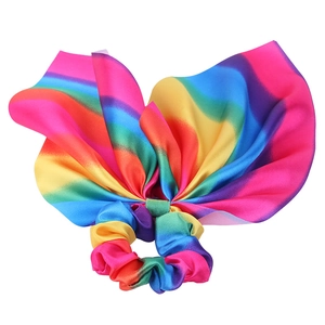 Rainbow satin bow scrunchie with tassel knots on white background for girls