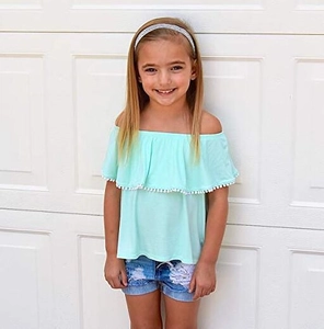 Kid's summer outfit with off-shoulder light green top and denim shorts on model