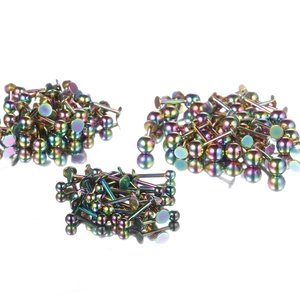 Rainbow stainless steel cone rivet labret piercings in professional flat lay display