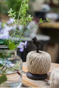 Vintage cast iron bird twine holder with jute rope for rustic garden decoration