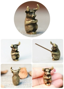 Macro detail of antique bronze ox incense burner holder showing texture and hole