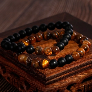Classic beaded bracelets set with matte black obsidian and natural tiger eye stones