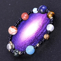 Detailed view of handmade beaded bracelet with colorful planetary stones and tree of life