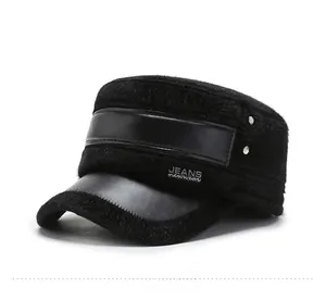 Close-up of black faux mink fur winter hat with leather brim and metal rivet details
