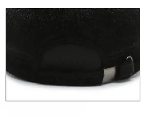 Detail of adjustable metal buckle and strap on black faux mink fur winter hat back