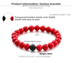 Macro detail of 8mm matte black agate and red turquoise beads with elastic cord