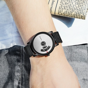 Men's WLISTH watch with black mesh strap and silver dial on wrist with newspaper