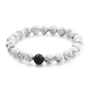 Minimalist white turquoise beaded bracelet with a black lava stone accent for couples