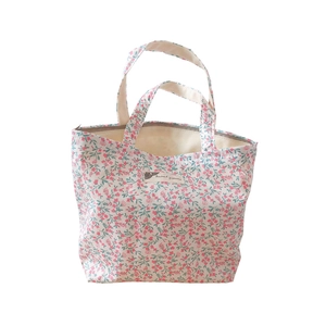 Floral cotton tote bag with pink flower pattern and woven label for summer casual use