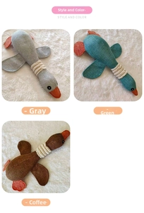Three durable plush duck dog toys in grey, green, and brown colors for chewing play