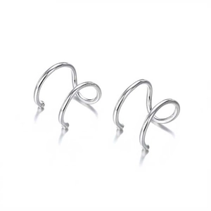 Detail view of silver double loop spiral ear cuffs with geometric stainless steel design