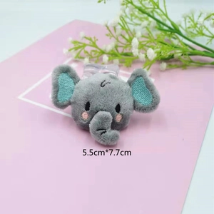 Detail of 5.5cm x 7.7cm gray plush elephant patch with soft fabric and blue ear embroidery