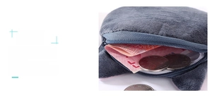 Detail showing the large capacity of the plush cat coin purse with zipper closure