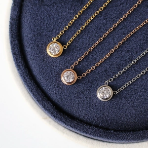 Three dainty titanium steel necklaces in gold, rose gold and silver with zircon pendants