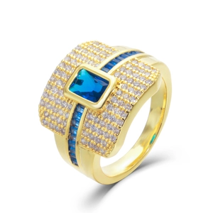 Gold plated fashion ring featuring a blue rectangular gemstone and zircon pavé detailing