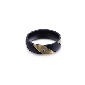 Two-tone matte black and frosted gold steel ring featuring a small inset zircon stone