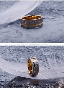 Detail of brushed black stainless steel ring with Love Only You engraving and small diamond