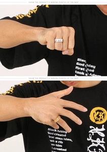 Detail view of steel gold-tone bands with Love You engraving on model hand