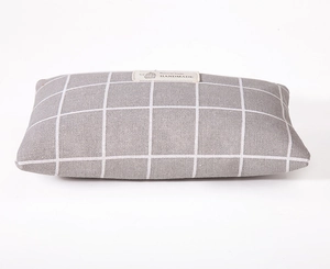 Detail of grey and white checkered linen makeup bag with handmade natural style label