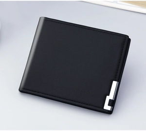 Close-up of black lychee grain leather wallet with silver metal L-shaped accent