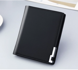 Close-up of black men's short wallet with lychee leather texture and silver metal detail