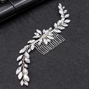 Silver bridal hair comb with marquise rhinestones and vine leaf design on dark background