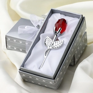 Detail view of red crystal rose with silver stem in a heart pattern gift box