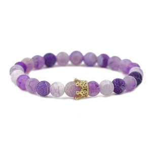 Purple cracked agate beaded bracelet with a gold crystal crown charm on white background
