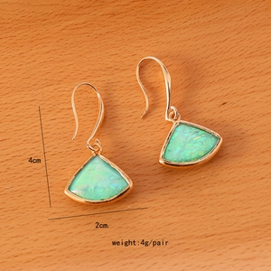 Detailed view of gold fan-shaped drop earrings with green stone and size measurements