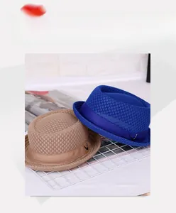 Detail of breathable mesh jazz hats in navy and khaki with silk ribbon and metal V accent