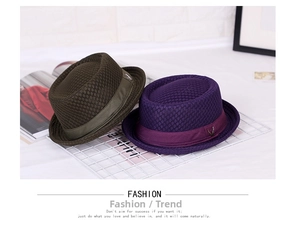 Close-up of breathable mesh trilby hats in olive and purple with metal V-buckle details