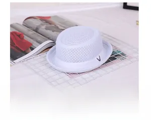 Close-up of breathable mesh fedora with white ribbon band on a stylish grid stand