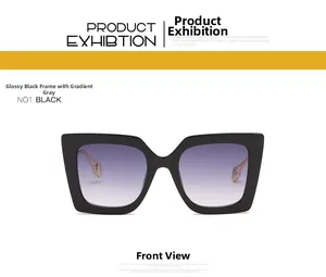Front view detail of oversized black frame sunglasses with purple-grey gradient lenses