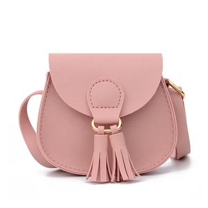 Pink mini crossbody bag for kids featuring PU leather with gold ring and tassel accents