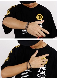 Detail of men's vintage double-layer titanium steel chain bracelet set on wrist