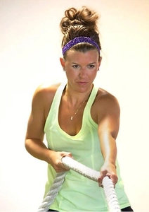 Purple sequin elastic sports headband shown on a female model during workout